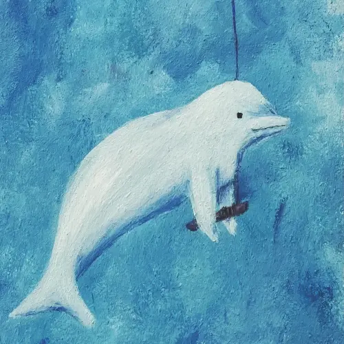 Una beluga deja volar una cometa en las aguas